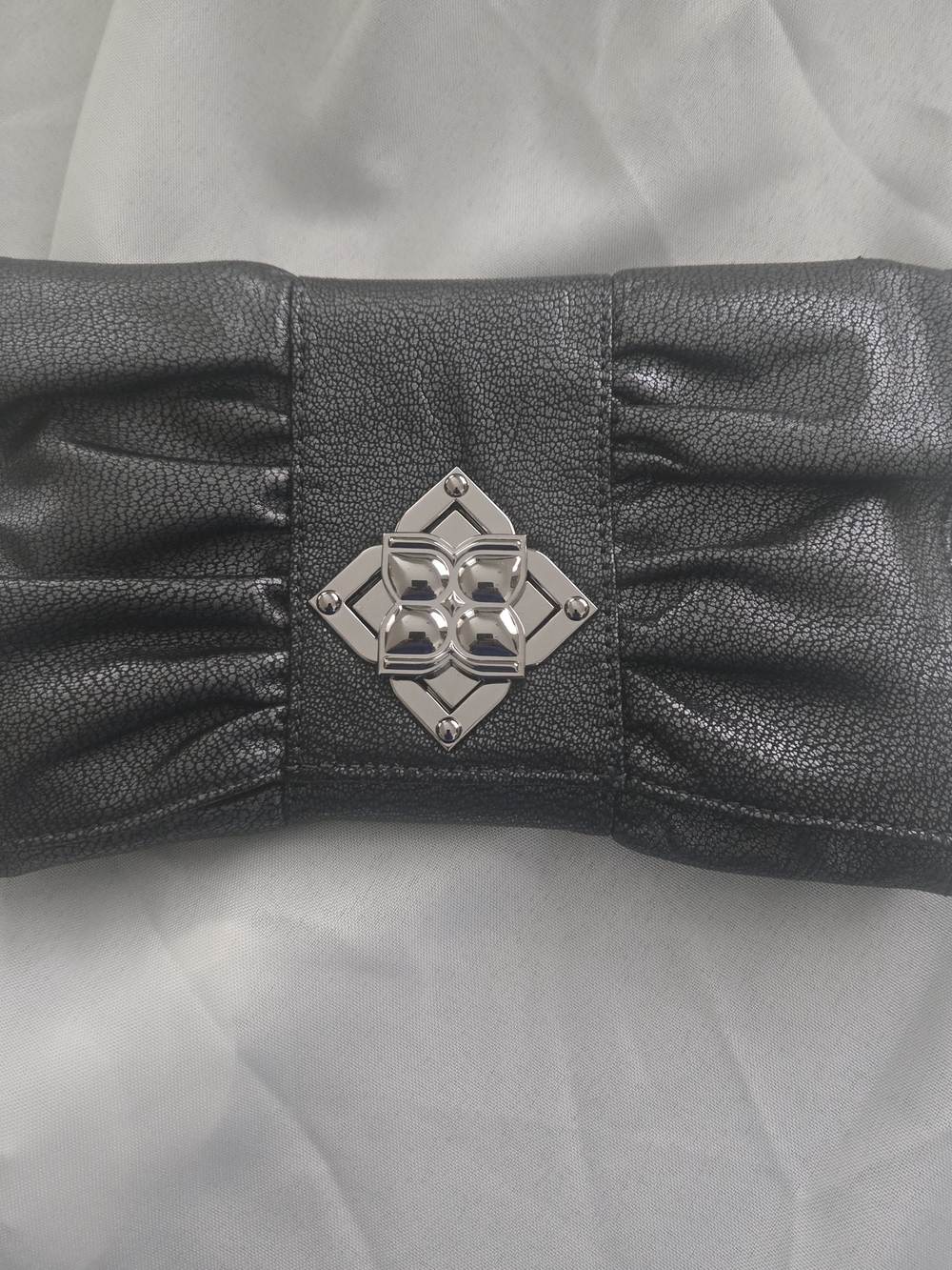 BCBGMaxAzria Black Clutch with Silver Tone Emblem